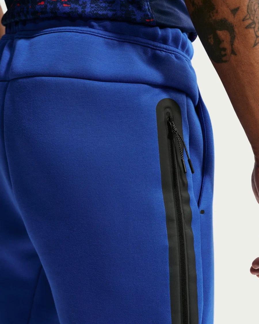 Pantalon Tech Fleece équipe de France bleu roi, poche zippée noire sur la cuisse